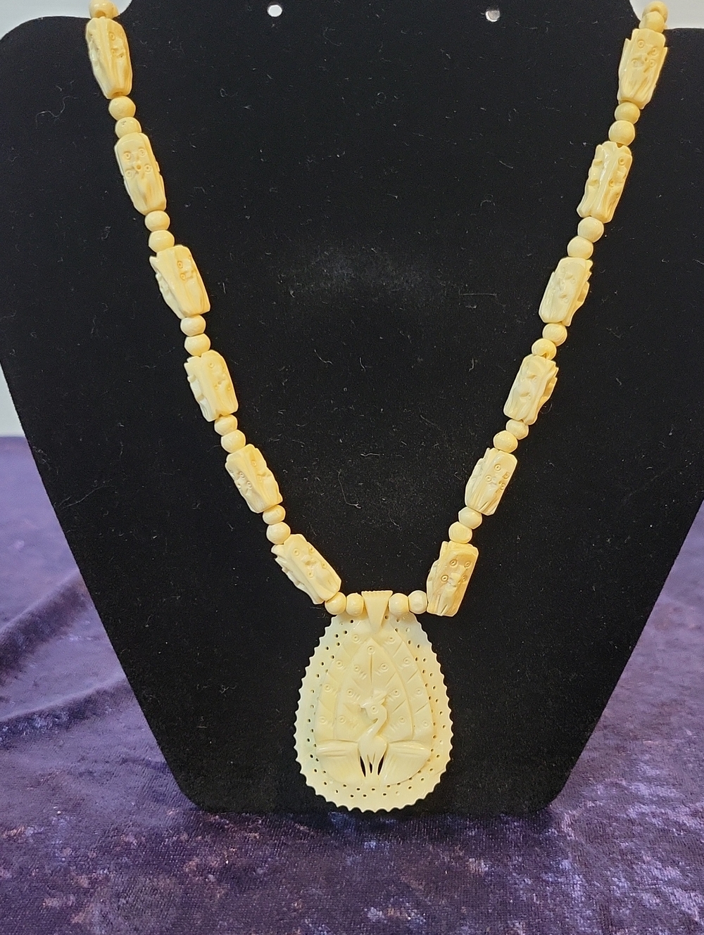 Vintage Faux Ivory Carved Necklace with Tribal Mask Beads and Bird Pendant